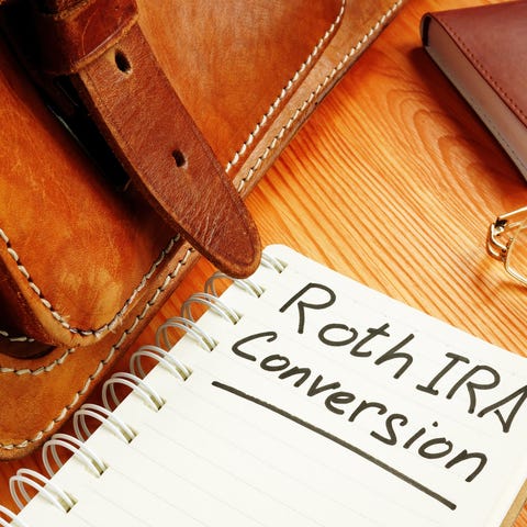Notebook with the words Roth IRA Conversion writte