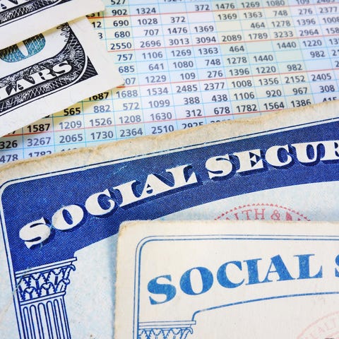 Two Social Security cards and two one hundred doll