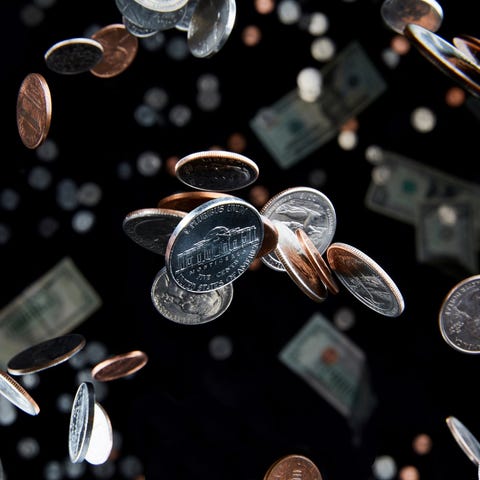 U.S. coins falling through the air.
