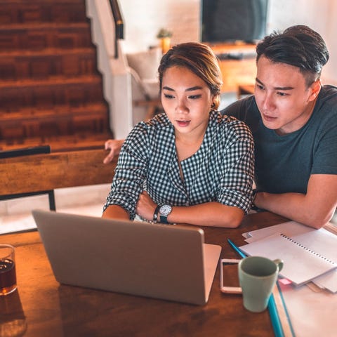 Couple looking at laptop together.