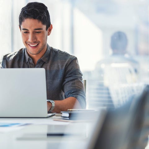 A person at a laptop.