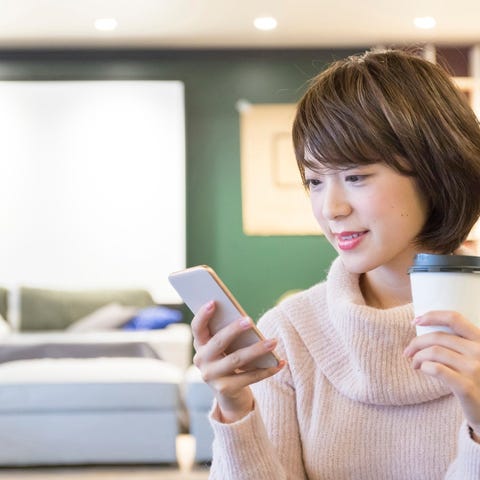 A person looks at a smartphone.