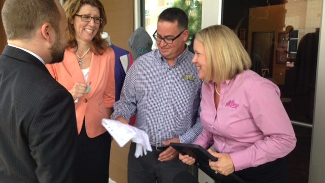 Danny and Tracey Shrine, owners of Full Press Apparel on Gaines Street, share a laugh with County Commissioner Kristen Dozier during Thursday’s press conference. The company was recognized by the Greater Tallahassee Chamber of Commerce in the “Made in Tallahassee” campaign highlighting local businesses with national and global clients.