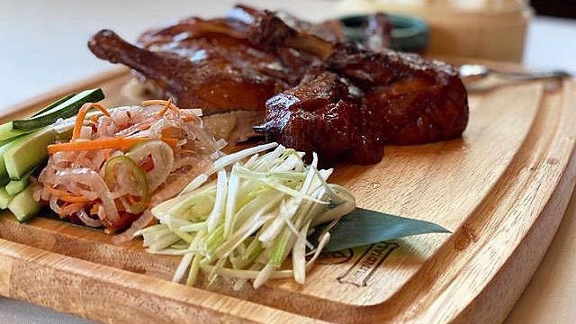New summer dishes at LoLa 41 include crispy-skin duck for two, served with scallions, pickled vegetables, hoisin sauce and steamed buns.