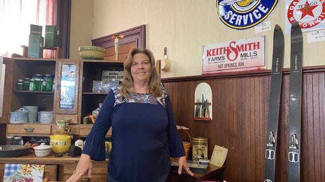 Amy Cox stands near items that are inside her new antique shop called Mystic Rose Antique, 429 Pulaski St., in Lincoln.