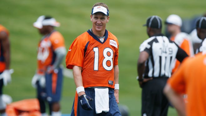 Denver Broncos quarterback Peyton Manning looks on during an NFL football minicamp at the team's headquarters Thursday, June 11, 2015, in Englewood, Colo.