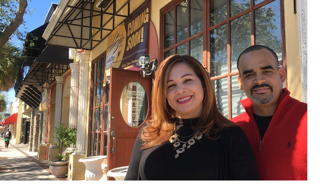 El Antojo owner Ramon Ortiz and Yuderka Rodriquez, his business partner, stand outside their future restaurant in downtown Melbourne.