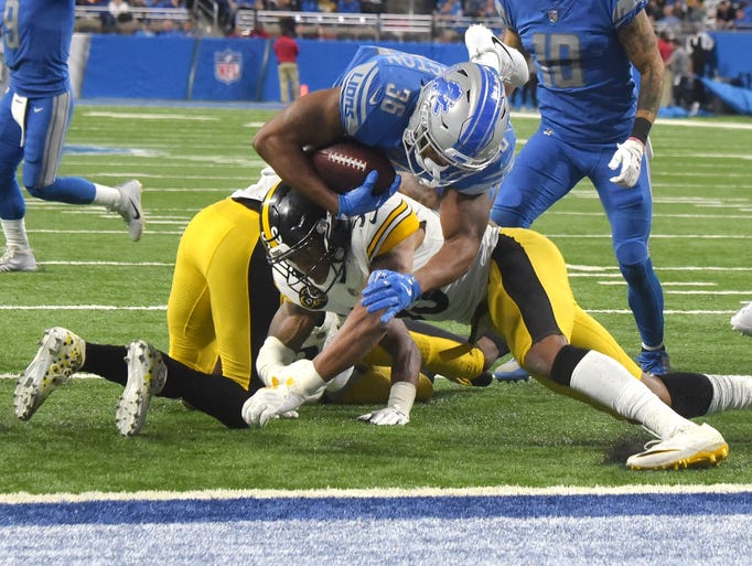 Lions' Dwayne Washington is heading for the end zone