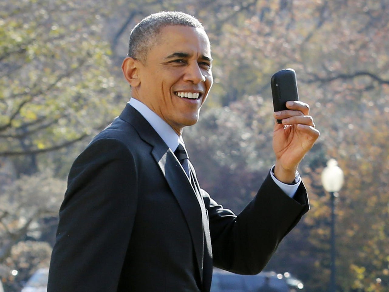 President Obama shows off his BlackBerry phone.