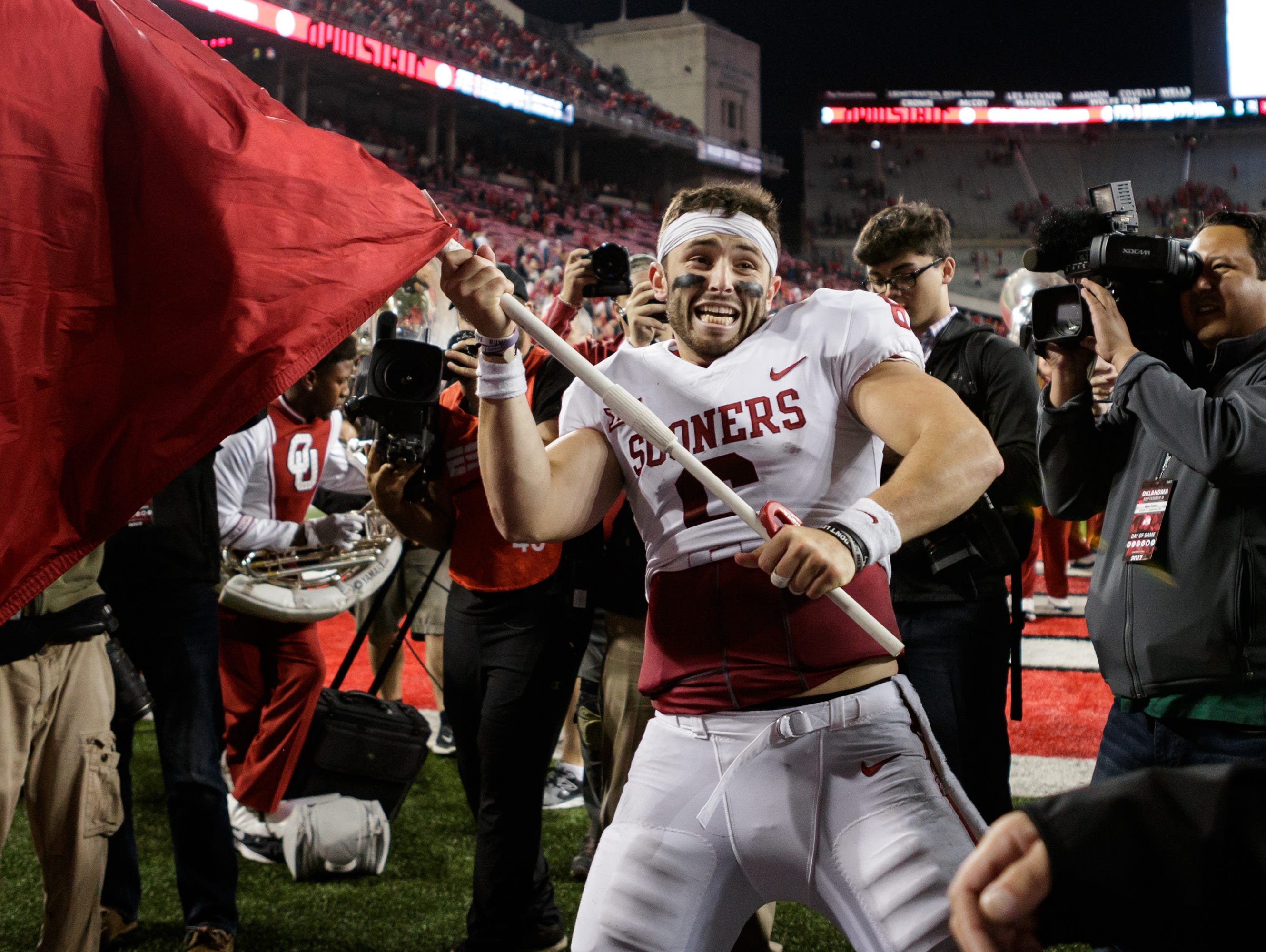 September 9th, 2017: Oklahoma Sooners quarterback Baker Mayfield (6) waves the OU flag on the field after a NCAA football game between the Ohio State Buckeyes and the Oklahoma Sooners at Ohio Stadium, Columbus, OH. Oklahoma defeated Ohio State 31-16.