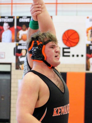 Kewanee's Trevor Simaytis is declared the victory in the 285-pound weight class with a 2-1 decision over Jason Lopez of Morrison.