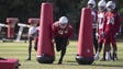 Cardinals Tyvon Branch (27) runs a drill during practice