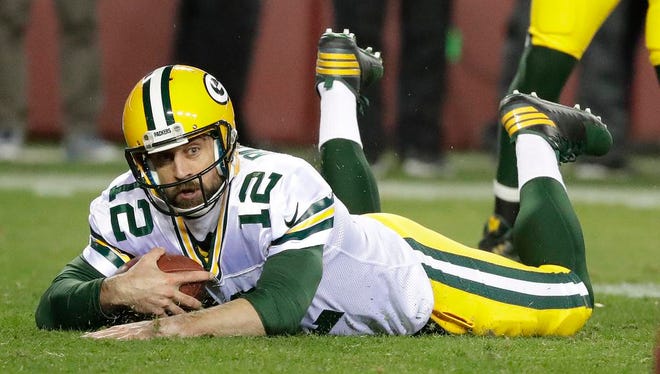 Green Bay Packers quarterback Aaron Rodgers (12) dives forward for a first down against Washington at FedEx Field in Landover, Maryland, November 20, 2016.