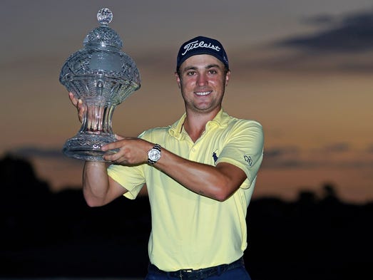 Justin Thomas celebrates after winning The Honda Classic