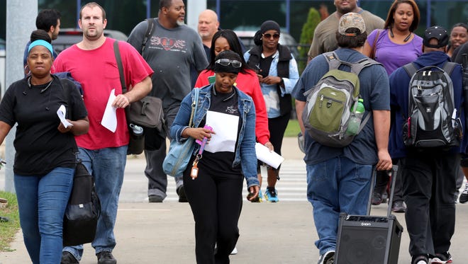 Workers leave the afternoon shift at the Warren Truck Assembly Plant in Warren, Michigan on Tuesday with potential strike instruction papers from their union, the United Auto Workers .
The UAW and Fiat Chrysler Automotive have reached a new proposed tentative agreement.