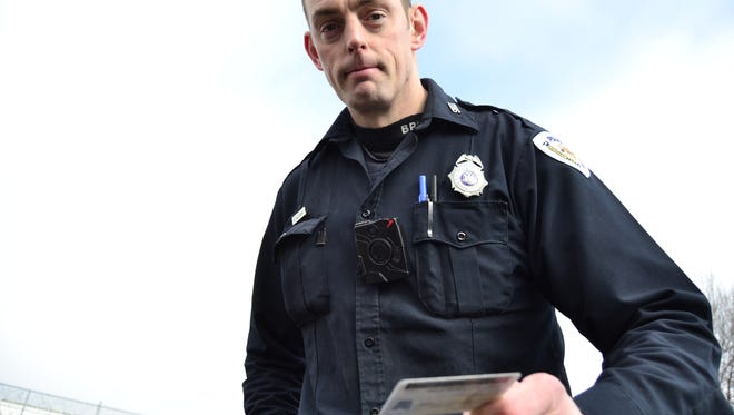 Binghamton Police Department Patrolman Brad Kaczynski wearing a body camera during a demonstration of pulling over a vehicle wearing the device Monday.