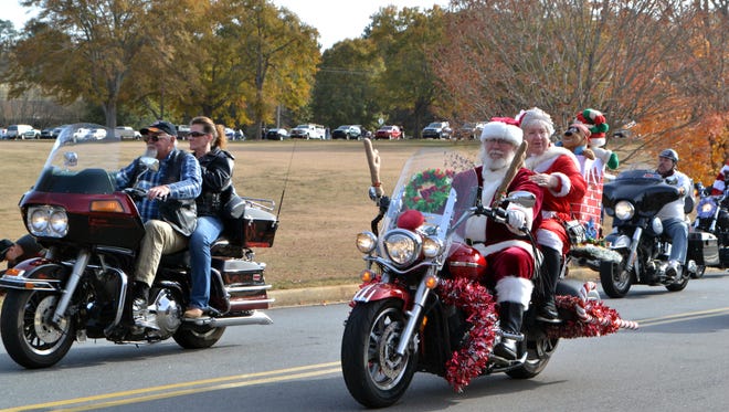 Santa and Mrs. Claus join the annual Jack Hurley Anderson Toy Parade on Sunday at the Civic Center of Anderson.