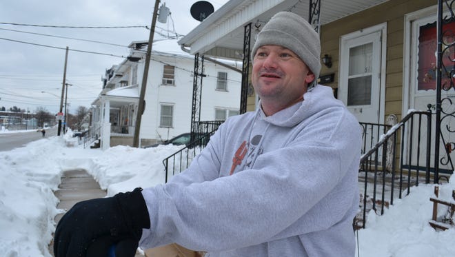 West York resident Thomas Koons stands in front of his home after shoveling snow on his sidewalk. Koons has epilepsy, and is hoping that recently legalized medical marijuana will help to control his seizures. He hopes a York-based company, Five Leaf Remedies, will get a state permit to open a medical marijuana growing facility in York.