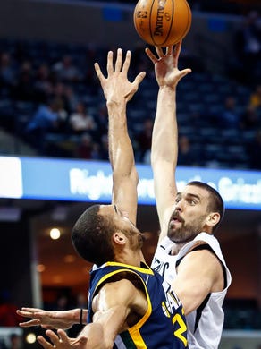 Memphis Grizzlies center Marc Gasol (right) drives