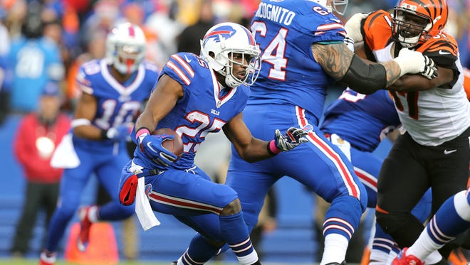 Bills running back LeSean McCoy looks for a hole at the line of scrimmage.  He rushed for 90 yards and a touchdown. 