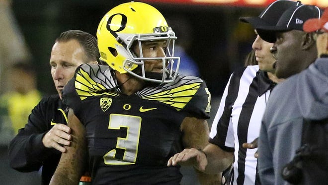 Oregon Ducks quarterback Vernon Adams (3) leaves the game after getting hit after the play was over during their game with Eastern Washington on Sept. 5, 2015, in Eugene, Ore.