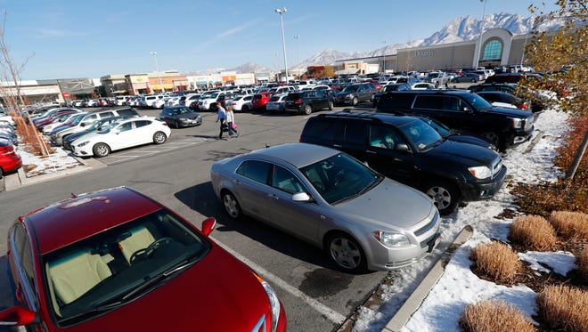 The parking lot is full of cars at the Fashion Place Mall in Salt Lake City, Utah.
