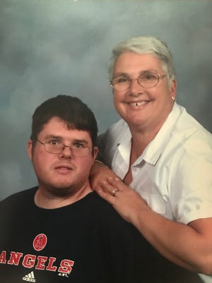 Chris Hazencomb, left, is seen in this picture taken in the early 2000s with his mother, Maryanne Hazencomb.
