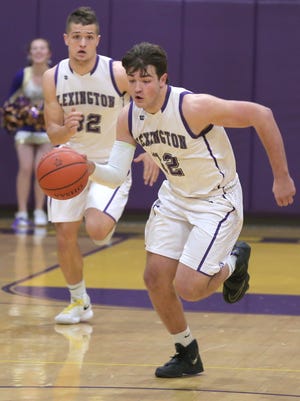 Lexington's Ben Vore heads downcourt with the basketball in Friday night's game with Mount Vernon. Vore scored 16 points as the Minutemen upended the front-running Yellow Jackets to earn a share of the Ohio Cardinal Conference title.