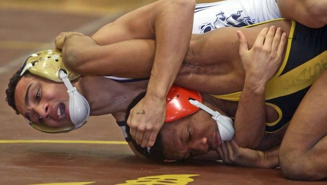 Trey Wardlaw of East Ramapo defeated Justin Lopez of Yonkers 9-0 to win the 99 pound title at the Division 1 sectional wrestling championships at Clarkstown South High School Feb. 15, 2015.