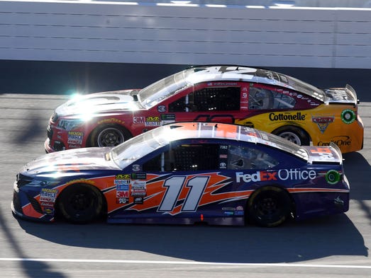 Denny Hamlin (11) and eventual winner Kyle Larson (42)
