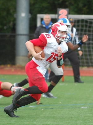 Delsea quarterback Quinn Collins looks for running room in the second half of Saturday's game. The senior rushed for 185 yards and three TDs,