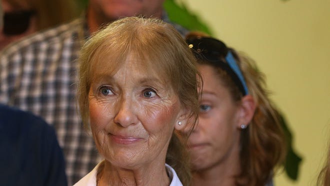 Diana Batzel Powers, sister of Raymond Batzel, who was killed during the 2003 robbery of the Xerox Federal Credit Union, during a news conference announcing the arrest in the case.