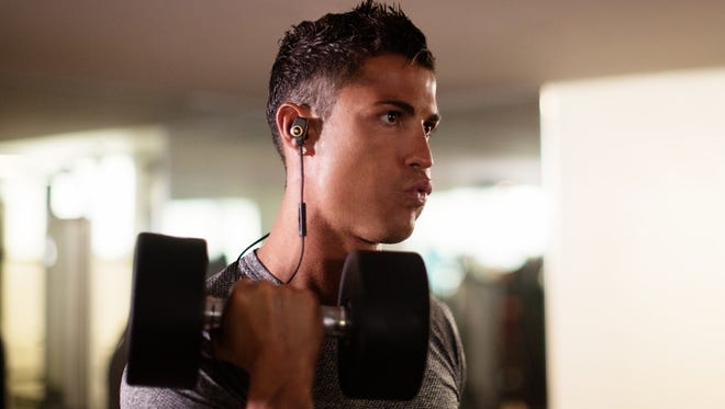 Cristiano Ronaldo wearing the ROC Sport Superslim Wireless In-Ear Headphones.