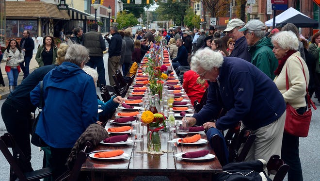 In this file  photo, about 200 people gather in the middle of Beaver Street in York for the Farm to City Street Dinner featuring food freshly harvested from local farms, Sunday October 4, 2015. (John A. Pavoncello - jpavoncello@yorkdispatch.com)