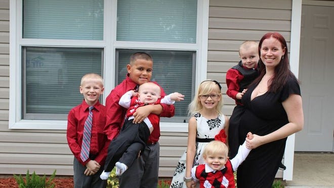 Jessica Olson and her six children, James, 8, Jay, 10, Josiah, 1, Jacey, 7, Jeremiah, 2, Jaxon, 3, are anxious to spend Christmas in their new Habitat home.
