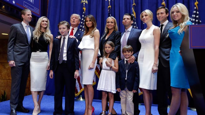 Kushner poses with the Trump family after Donald Trump's announcement that he will run for president on June 16, 2015, in New York.