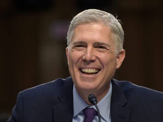 Supreme Court Justice nominee Neil Gorsuch smiles as