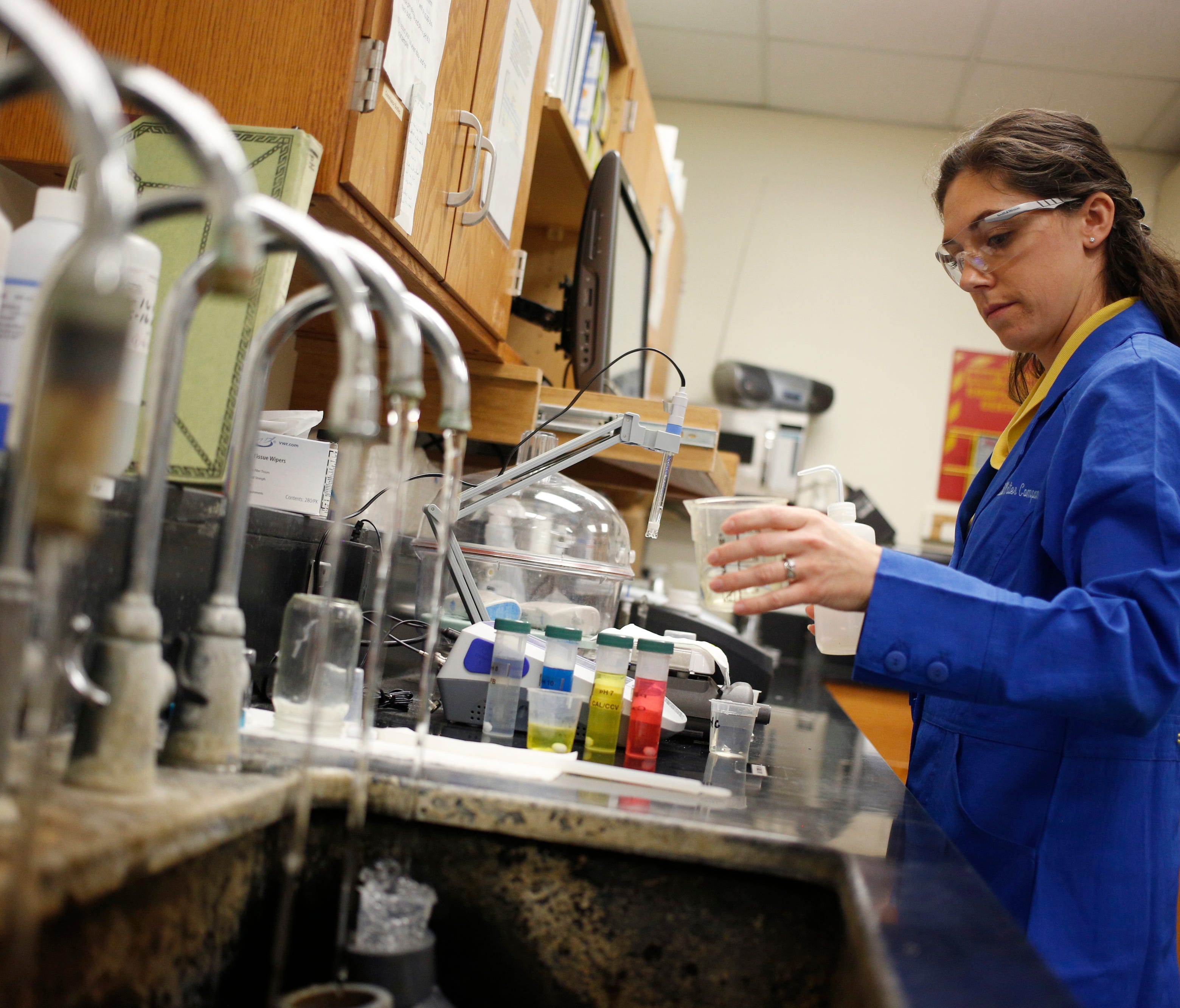 4/29/16 10:33:18 AM -- Louisville, KY  --   Nicole Estes performs a water quality analysis in a laboratory at the Louisville Water Company's Crescent Hill filter plant on Friday, April 29, 2016 in Louisville, KY.   Looking at the differences and simi