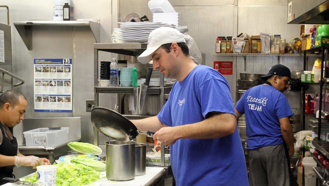 Co-owner Billy Kokoronis in the kitchen at Tzatziki Greek Grill in New Rochelle.