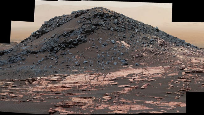 Ireson Hill rises about 16 feet above redder layered outcrop material of the Murray formation on lower Mount Sharp, Mars. Researchers used the Curiosity rover's Mast Camera on Feb. 2, 2017, during the 1,598th Martian day, of its work on Mars, to take the 41 images combined into this scene. The mosaic has been white-balanced so that the colors of the rock and sand materials resemble how they would appear under daytime lighting conditions on Earth.