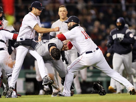 Mitch Moreland, right of the Red Sox, works to separate