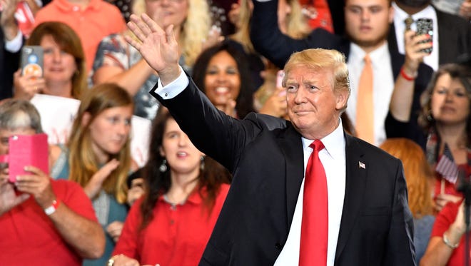 President Donald Trump waves to the crowd during a rally at Municipal Auditorium, Tuesday, May 29, 2018, in Nashville, Tenn.