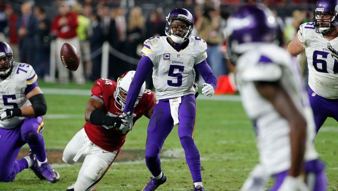Arizona Cardinals inside linebacker Dwight Freeney (54) forces Minnesota Vikings and former U of L quarterback Teddy Bridgewater (5) to fumble during the second half of an NFL football game, Thursday, Dec. 10, 2015, in Glendale, Ariz. The Cardinals recovered the ball to secure the 23-20 win.