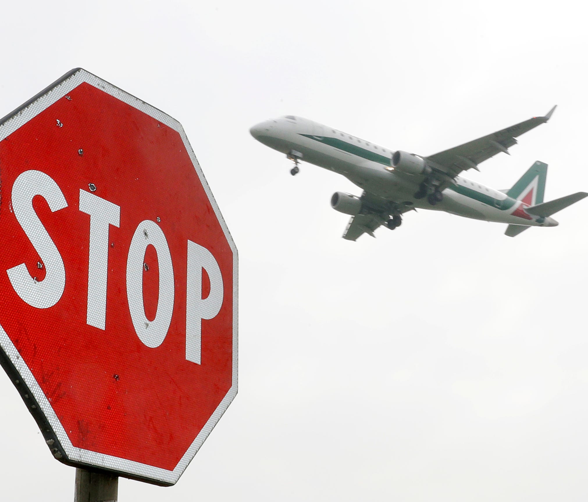 An Alitalia plane comes in for landing at Linate Airport, in Milan, Italy, on Monday, March 20, 2017.
