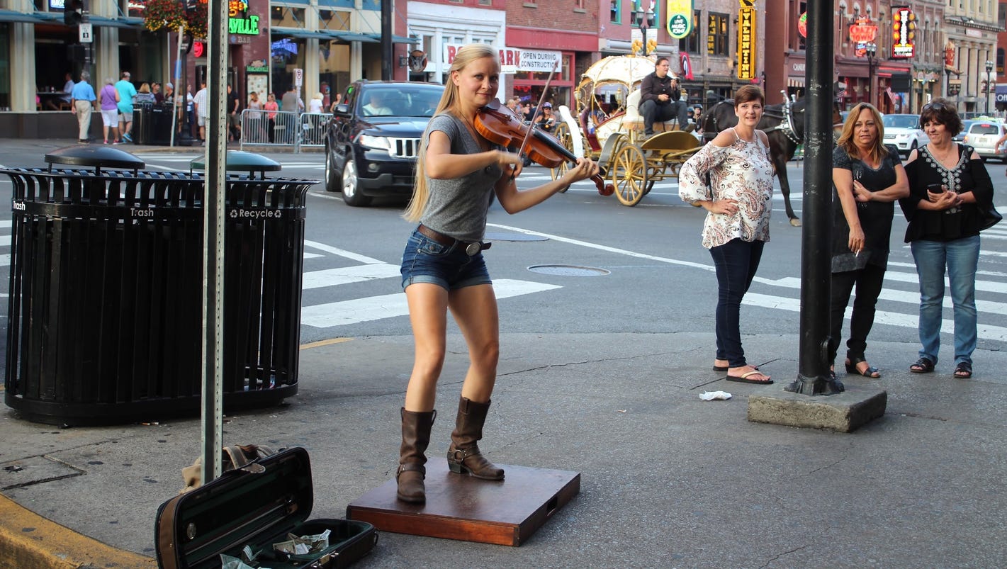 MTSU grad Hillary Klug uses her feet and fiddle to busk ... Hillary Klug
