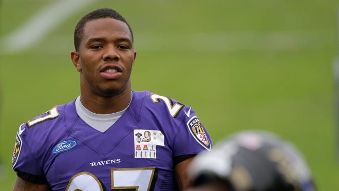 Baltimore Ravens running back Ray Rice walks on the field during a training camp practice, Thursday, July 24, 2014, at the team's practice facility in Owings Mills, Md.