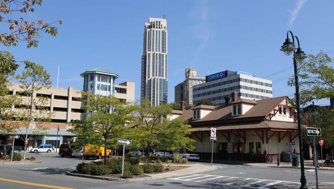 The office buildings and residences along North Avenue and Huguenot Street in downtown New Rochelle loom over the train station, Oct. 8, 2015. 