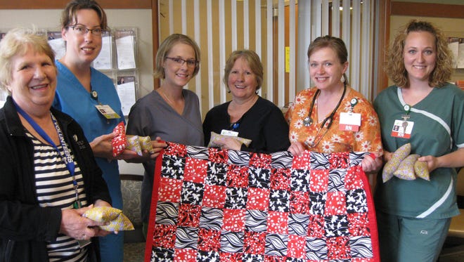 Aspirus Volunteers-Medford Craft Committee recently donated a handcrafted lap robe and weighted bags for use by patients of Aspirus Kidney Care in Medford. Patients can rest their hands on the bags during treatment.