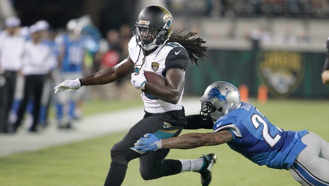 Aug 28, 2015; Jacksonville, FL, USA; Jacksonville Jaguars running back Denard Robinson (16) is tackled by Detroit Lions free safety Glover Quin (27) during the second quarter of  an NFL preseason football game at EverBank Field.