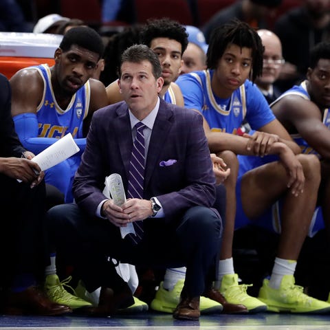 UCLA head coach Steve Alford and his players...